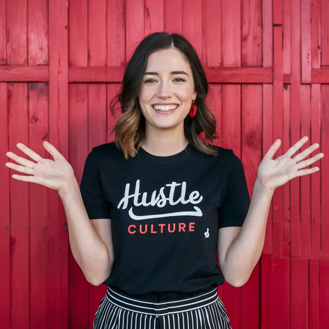 A Woman Wearing a Hut Culture T-shirt Displaying Essential Healthy Habits For Remote Work Success.