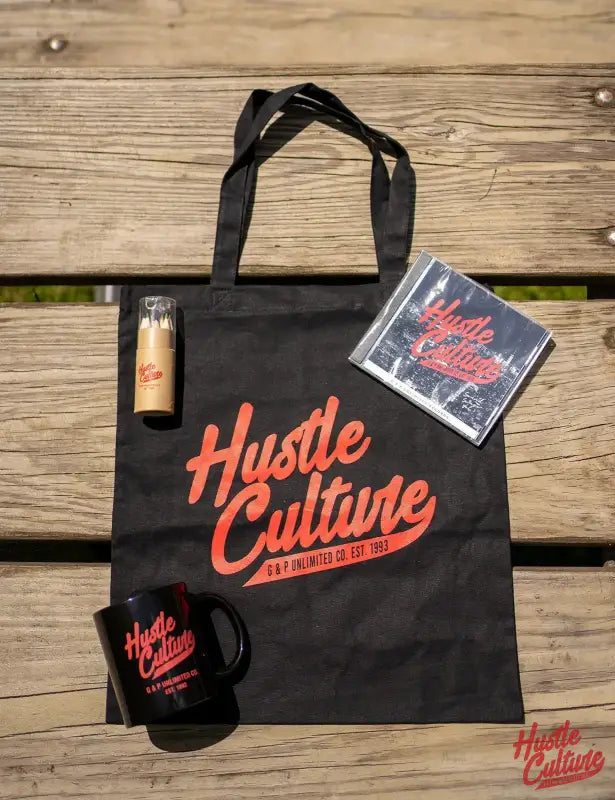 Black Bag, Beer Bottle, And Book In Ambition T-shirt From Hustle Culture Box