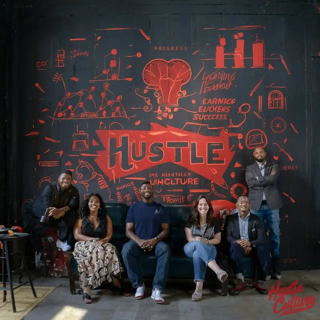 Group Of People Sitting On a Couch In Front Of a Mural, Embodying Hustle Culture