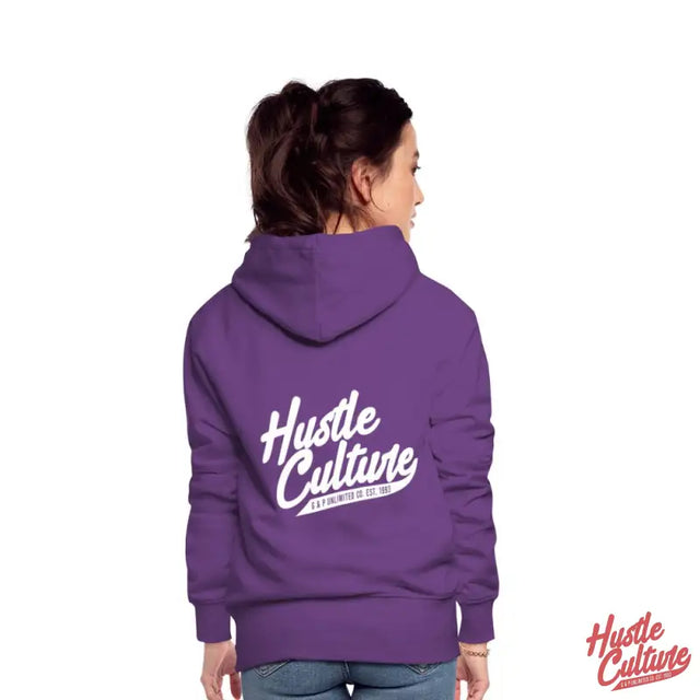 Empowering Girl Hoodie With Hut And Hustle Design Worn By a Woman In Purple Hoodie